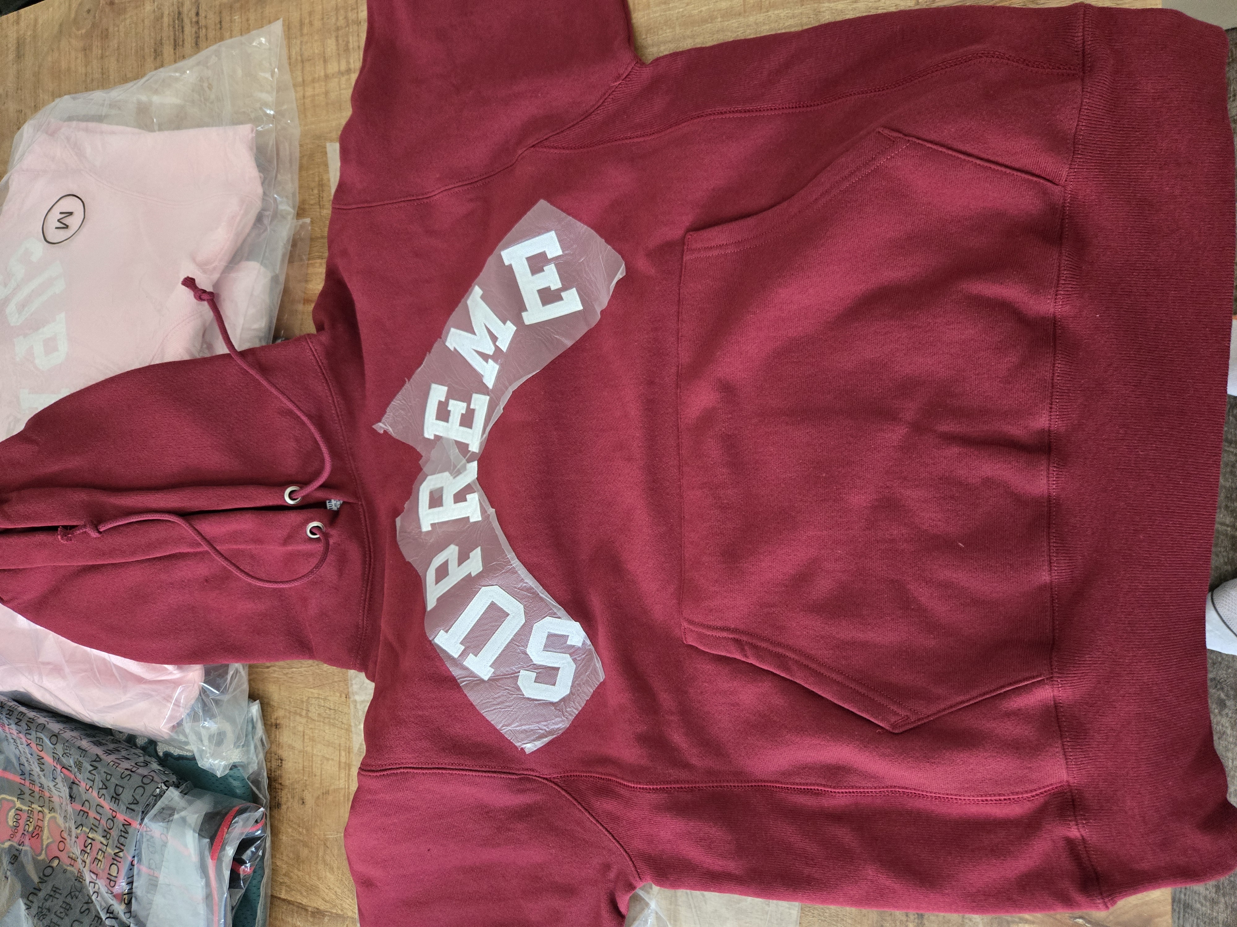 Supreme Champion Hooded Sweatshirt 'Cardinal' (SS25) photo 1